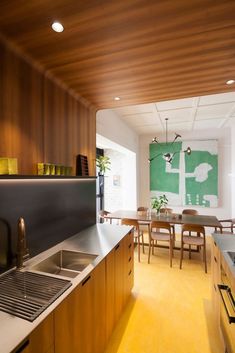 the kitchen is clean and ready to be used for dinner or lunch time, as well as dining room furniture