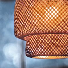 two lamps hanging from the ceiling in a room