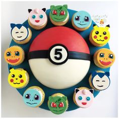 cupcakes are arranged in the shape of a pokemon ball