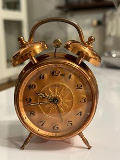 an alarm clock sitting on top of a table