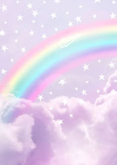 a rainbow in the sky with white stars