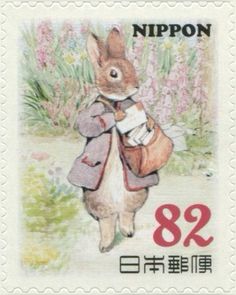 a postage stamp with an image of a rabbit holding a bag in it's hands