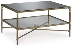 a metal and glass coffee table with two shelves