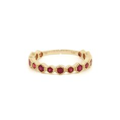 This semi-eternity band sets the standard for beauty and elegance. Fashioned in 14k gold, the ring is designed with a half-shank hexagon pattern with milgrain-detailed edges, bedecked with 15 round rubies. This bright red rubies paired within the luxurious gold design are a guaranteed conversation starter.  Dimensions- Size: 7.25 Height: 3mm Width: 21mm Code: DGJRHB1 (MNE) Eternity Band Set, Rubin Ring, Hexagon Pattern, Red Band, Ruby Ring, Eternity Band, Gold Design, Eternity Bands, Rings Statement