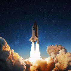 a space shuttle taking off into the sky with clouds and stars in the night sky