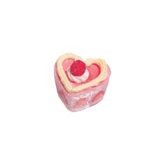 a small heart shaped cake with a raspberry on top