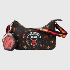 **Now Shipping** This classic Loungefly “baguette” bag carries the Hellfire Club logo, which glows in the dark! The logo repeats as a motif in an all-over pattern across the bag. Flames shoot across the straps, and a detachable coin bag, featuring the winning roll of the dice, creates extra room for storing smaller items. This bag is an officially licensed Netflix product. Dimensions: 8.75”W x 6”H x 2.5”D Material: Faux leather (polyurethane) Features: Bag has adjustable shoulder strap, a detach Stranger Things Hellfire Club, The Hellfire Club, Stranger Things Hellfire, Netflix Stranger Things, Hellfire Club, Eddie Munson, Loungefly Bag, Effortless Fashion, Club Logo