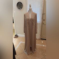 This One Of A Kind Elegant Abaya Has Lovely Sequin Details On The Front And Sleeves Adorned With Gold Rhinestones On Sleeves. Will Accept Offers Embellished Long Evening Abaya, Elegant Long Beige Kaftan, Elegant Beige Long Thobe, Elegant Long Beige Thobe, Elegant Beige Wedding Thobe, Elegant Long Beige Abaya, Gold Rhinestone, Accent Colors, Gold Accents