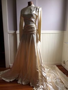 "Custom designed wedding gown from the late 1940's (1948-49) . Made for a woman who was approximately 115- 120 lbs and approximately 5'7\" tall. This gown could have be made by designer Caroline Herrera the workmanship and simple elegance screams her namesake. The icy pink satin is stunning in this gowns design, as is the pleated bustle back. Measurements are; Armpit to armpit Waist Feel free to convo me with any further questions. Thank you for your interest." Gold Full Length Wedding Gown, Gold Full-length Wedding Gown, Gold Full Length Gown For Wedding, Gold Full-length Gown For Wedding, Fitted Bodice Floor-length Gown For Vintage Events, Floor-length Gown With Fitted Bodice For Vintage Events, Gold Fitted Wedding Dress For Debutante Ball, Fitted Gold Wedding Dress For Debutante Ball, Vintage Floor-length Gown For Debutante Ball