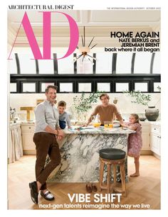 the front cover of architectural digest magazine, featuring a man and two children at a kitchen island