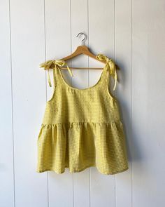 A little blast of sunshine 🌞 the Chloe Top in a bright gingham seersucker! Find it first at the Pop Up on Sunday, April 14th @luckygirlpopup 🌻 #luckygirlpopup #shopsmallcanada #handmadeclothing #slowfashion #slowsewing #shopsmall #shoplocal #smallbatchfashion #smallbatchclothing #springtop #ginghamtop Diy Top Design, Tops Patterns Sewing, How To Sew A Babydoll Top, Simple Tops To Sew, How To Sew Babydoll Top, Cute Sewing Projects Clothes, Sewing Babydoll Top, Sewn Clothes