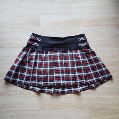 Tripp Nyc Mall Goth Punk Plaid Lace-Trim Pleated Mini Skirt Zip Black Red Polyester Blend Condition Is Pre-Owned In Great Condition. Please Note: -The Real Color Of The Item May Be Slightly Different From The Pictures Shown On Website Caused By Many Factors. -Don't Go By Size Number, Do Check Measurements Listed Below To Determine If The Item Will Fit. Measurements: Approximately (Laying Flat). -Waist: 19 Inches -Length: 17 Inches The Condition Guide: New With Tags - Never Been Used Condition. T Punk Plaid, Tripp Nyc, Goth Punk, Mall Goth, Pleated Mini Skirt, Black Red, Lace Trim, Size 16, Mini Skirt