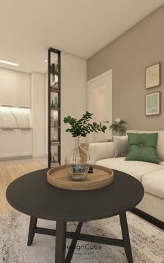 a living room with a couch, coffee table and plant on top of the table