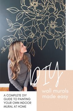 a woman standing in front of a wall with flowers on it and the words diy written