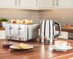 a toaster sitting on top of a kitchen counter next to a plate of food