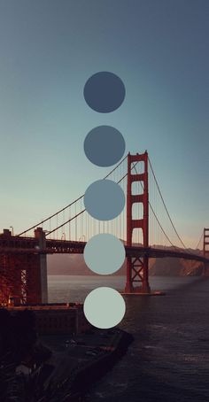 the golden gate bridge with circles hanging from it