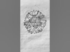 a piece of paper that has been drawn on with black ink and some type of design