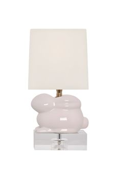 an elephant lamp with a white shade on it