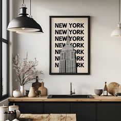 a kitchen area with a sink, counter top and large poster hanging on the wall