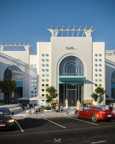 two cars parked in front of a white building