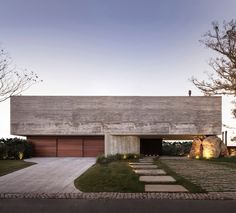 a concrete house with steps leading up to it