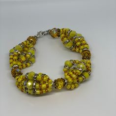 Handmade beaded ide bracelet inspired by and honoring the powerful Orisha Oshun.  Made with glass seed beads. Don't see your wrist size, message us! Yellow Czech Glass Bracelets With Round Beads, Yellow Faceted Beads Bracelet, Yellow Stretch Bracelet With Faceted Beads For Gift, Adjustable Amber Bracelet With Large Beads, Adjustable Amber Bracelets With Large Beads, Adjustable Yellow Faceted Beads Stretch Bracelet, Yellow Beaded Stretch Bracelet, Yellow Beaded Stretch Bracelet With Round Beads, Adjustable Amber Beaded Crystal Bracelet