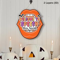 a sign that says welcome to speech mrs smith with pumpkins and candles in front of it