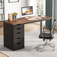 an office desk with drawers and a computer on it