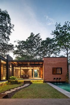 a house with a swimming pool in the backyard