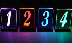 three lit up blocks with numbers on them