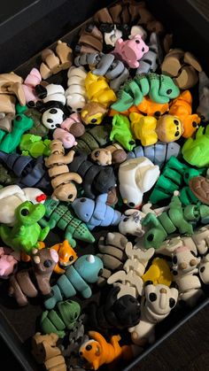 a box filled with lots of different colored toys