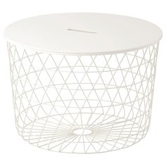 a white wire table with a circular top