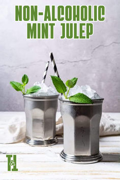 two silver cups filled with mint and ice