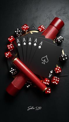 playing cards and dice on a black background