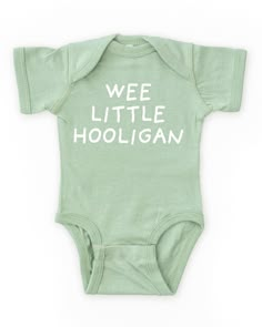 A funny and cute baby boy outfit for St. Patrick's Day! Features a white "wee little hooligan" print on our cozy gender neutral baby bodysuit. Made from buttery-soft airlume cotton that provides all day comfort, breathability and flexibility for all activity levels. ☑ 100% combed ringspun cotton☑ Buttery-soft, light-weight & breathable material☑ Gender neutral bodysuit☑ Flatlock seams☑ Double-needle ribbed binding on neck, shoulders, sleeves & leg opening☑ Reinforced three-snap closure☑ EasyTear Funny Gender Neutral Gifts, Gender Nuteral Baby Outfits, Neutral Baby Boy Clothes, Gender Neutral Baby Outfits, Cute Onesies For Babies, Neutral Bodysuit, Baby Clothes Gender Neutral, Gender Neutral Outfits