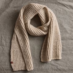 Cozy and warm, this knit scarf features a chunky waffle structure. The knit is made with three color twist yarns for a subtle marled effect. Bickley + Mitchell: The passionate, self-proclaimed knit obsessed at Bickley + Mitchell work to honor the craft that inspires them most. Based in Amsterdam, the company was founded in 2011 and has since strived to bridge the gap between fashion and function with its versatile hats, scarves, gloves, and socks. Bickley + Mitchell knitwear is driven by traditi Christmas Gifts For The Home, Color Twist, Chunky Scarves, Best Stocking Stuffers, Checked Scarf, Blanket Scarf, Sweater Pattern, Gift Accessories, Three Color