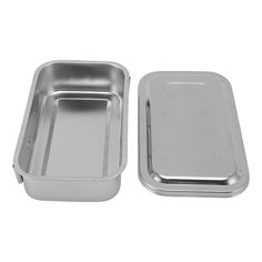 two stainless steel trays with lids on white background