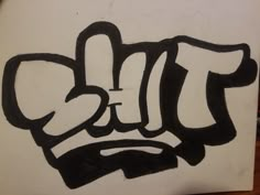 a piece of paper that has some type of graffiti written on it with black and white ink