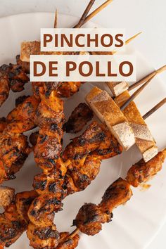 chicken skewers on a white plate with the words pinchos de pollo