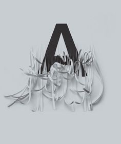 an image of a sign that is made out of forks and paper streamers with the letter a on it