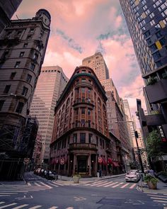 a city street with tall buildings on both sides