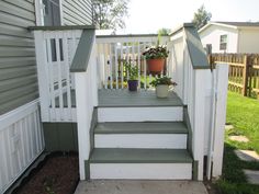 the steps leading up to the house are painted white