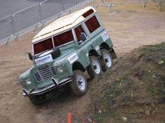 an off road vehicle driving down a dirt hill