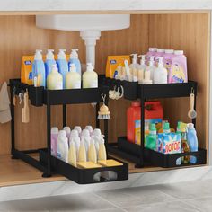 two black trays filled with different types of soap and lotion on top of a counter