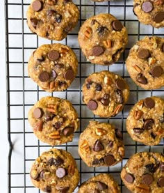 chocolate chip cookies with pecans and nuts on a cooling rack, ready to be eaten