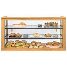 a display case filled with lots of different types of breads and pastries on shelves