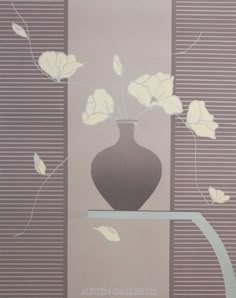 a vase with white flowers in it on a shelf next to a wallpapered background