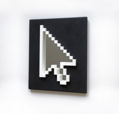 a pixelated black and white square with a gray speaker on it's side