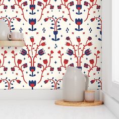 a kitchen with red, white and blue wallpaper