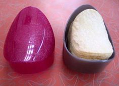 two pink and white heart shaped cakes sitting on top of each other next to each other